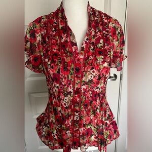 1990s red floral blouse with a flattering fit
Made by New York City design co